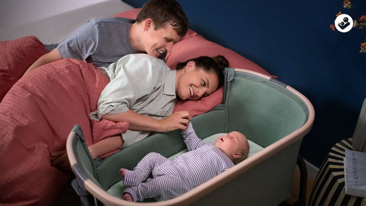 maxi cosi iora co-sleeper picture with baby and parents in bed using the bedside cot bassinet