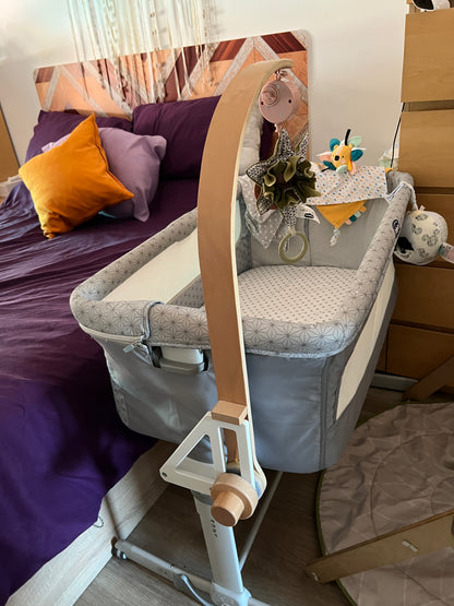 CribClamp baby mobile holder fitted to a Chicco Next2Me Dream bedside crib, providing a secure attachment for a Little Dutch wooden musical mobile.